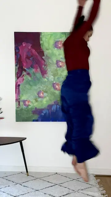 jumping in front of painting